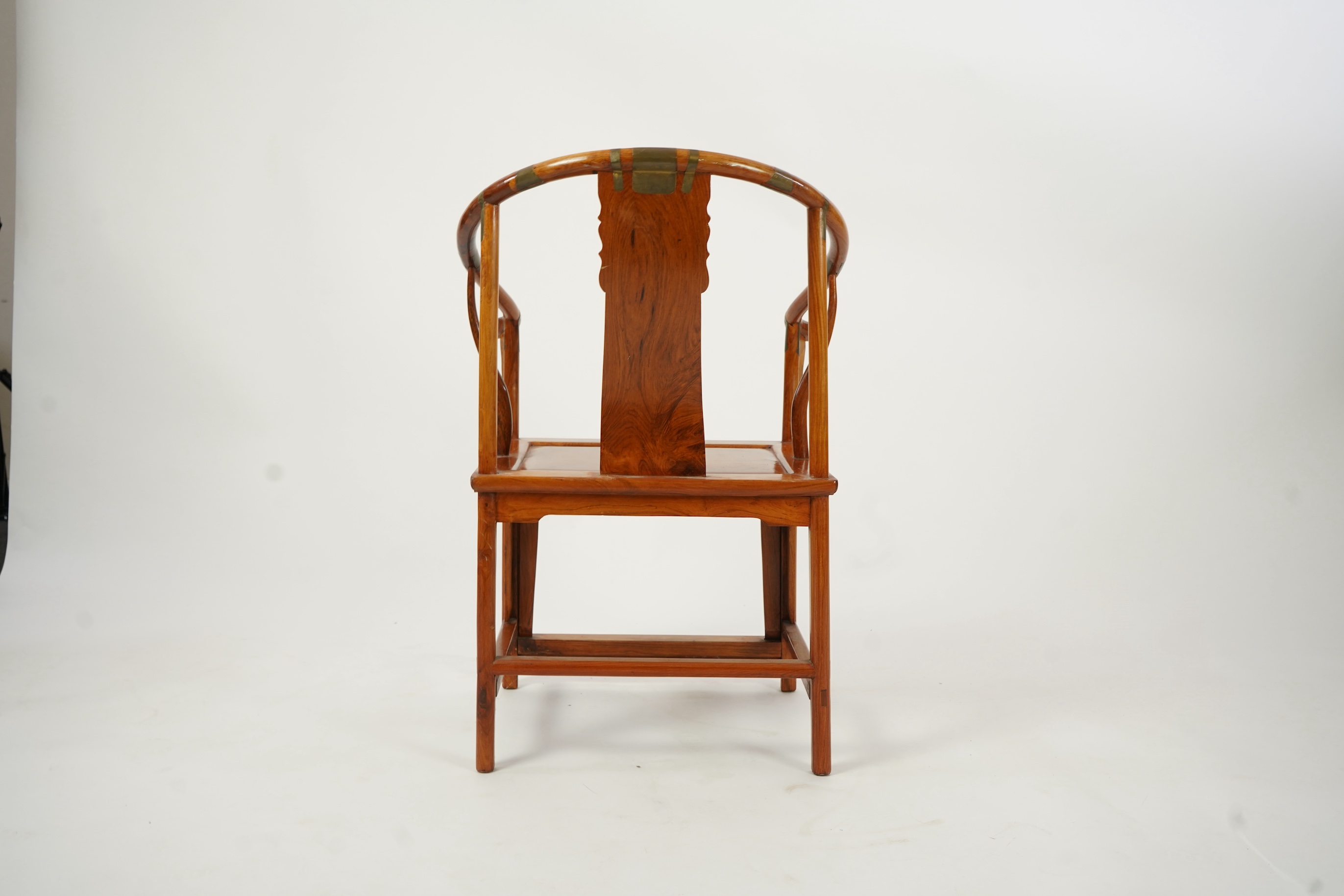 A Chinese huanghuali and brass mounted horseshoe-back armchair, quanyi, late 19th century